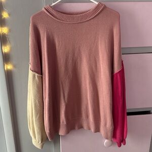 pink and cream color block sweater
